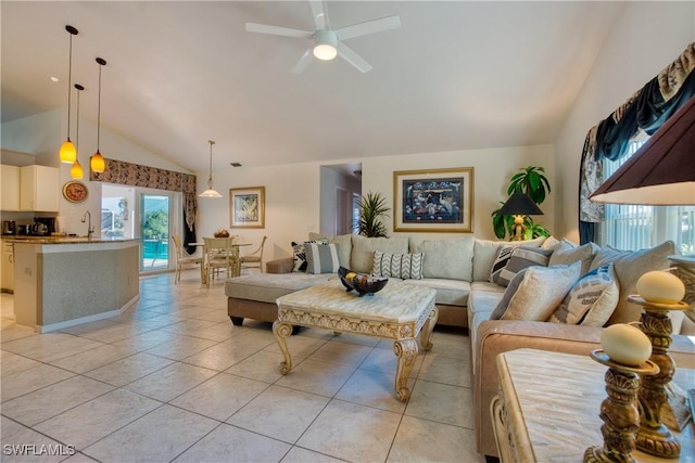 living room featuring vaulted ceiling, sink, light tile patterned floors, and ceiling fan