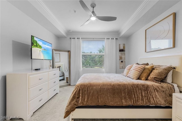 carpeted bedroom with ceiling fan and ornamental molding