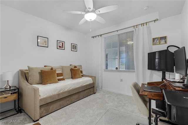 office space with ceiling fan and light colored carpet