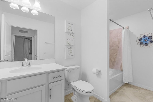 full bathroom featuring toilet, tile patterned floors, vanity, and shower / tub combo with curtain