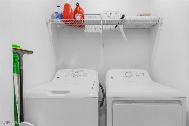 laundry room featuring separate washer and dryer