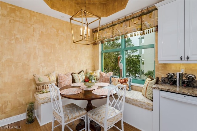 dining room with a chandelier and hardwood / wood-style flooring