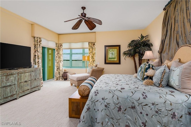 carpeted bedroom featuring ceiling fan