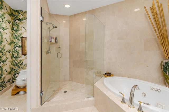 bathroom with toilet and separate shower and tub