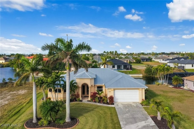 view of front of home with a garage, a residential view, driveway, and a front lawn