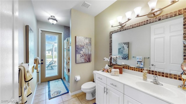 full bathroom with visible vents, toilet, tile patterned floors, curtained shower, and vanity