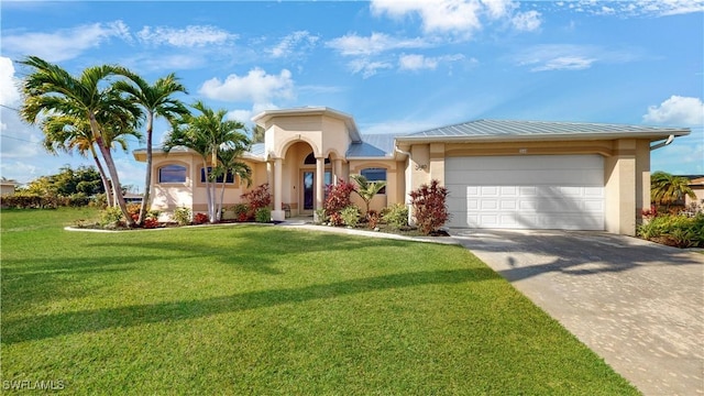 view of front of property with driveway, an attached garage, a front lawn, and stucco siding