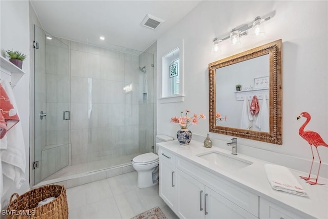 bathroom with toilet, tile patterned floors, an enclosed shower, and vanity