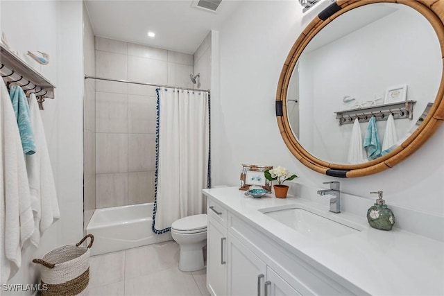 full bathroom with vanity, toilet, tile patterned floors, and shower / bath combo with shower curtain