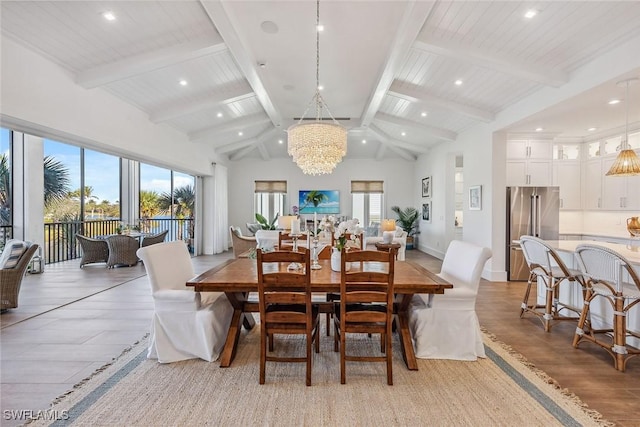 dining room with high vaulted ceiling, beamed ceiling, and an inviting chandelier