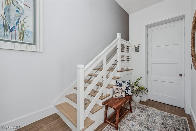 stairs with wood-type flooring