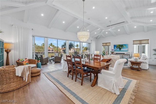 dining room featuring high vaulted ceiling, light hardwood / wood-style floors, beam ceiling, and a chandelier