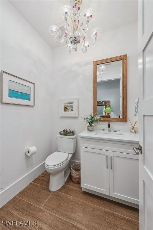 bathroom with toilet and vanity