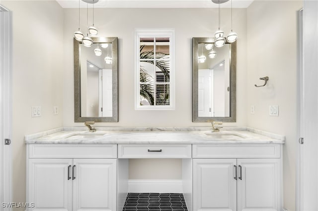 bathroom with tile patterned floors and vanity