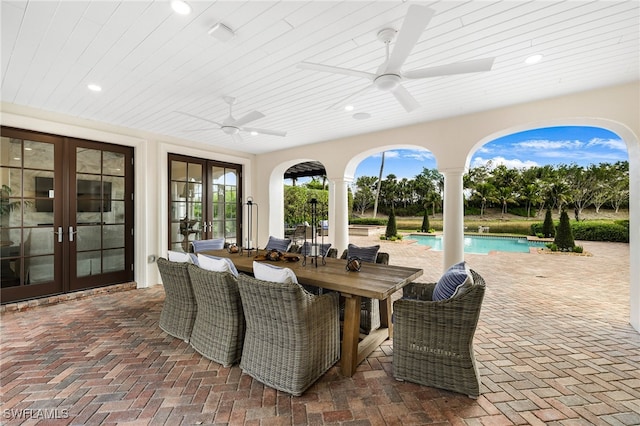 view of patio with ceiling fan and french doors