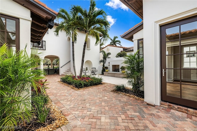 view of patio with an outdoor fireplace