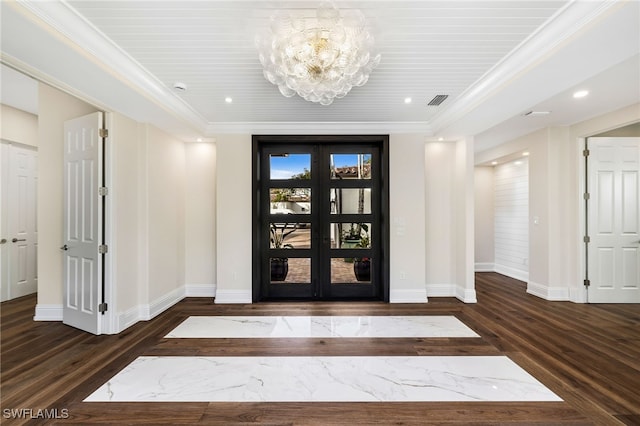 entryway with crown molding, dark hardwood / wood-style flooring, an inviting chandelier, and french doors