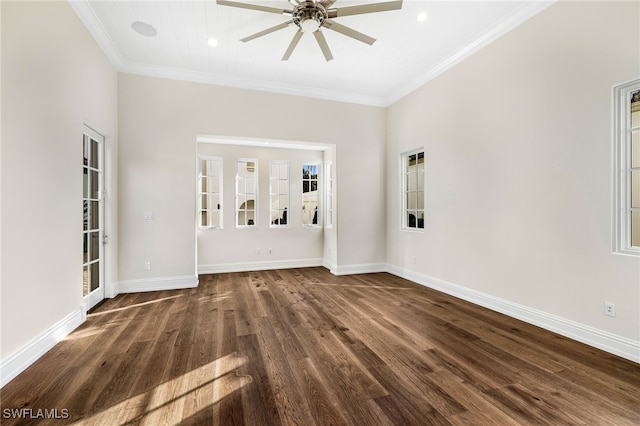 spare room featuring ceiling fan, dark wood-type flooring, and ornamental molding