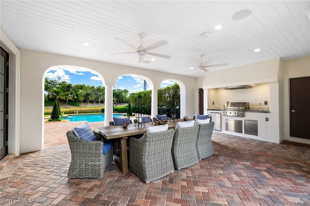 view of patio / terrace featuring area for grilling, grilling area, and ceiling fan