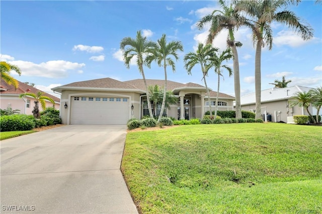 view of front of property with a garage and a front yard