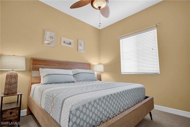 bedroom with ceiling fan and carpet