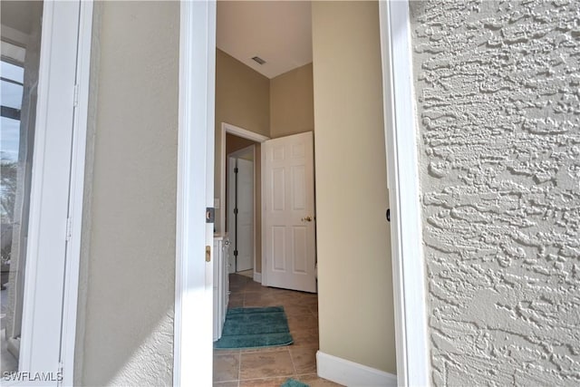 bathroom with tile patterned floors