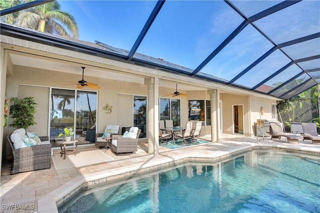 back of house featuring a patio, an outdoor hangout area, ceiling fan, and glass enclosure