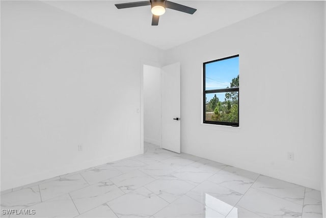 spare room featuring ceiling fan