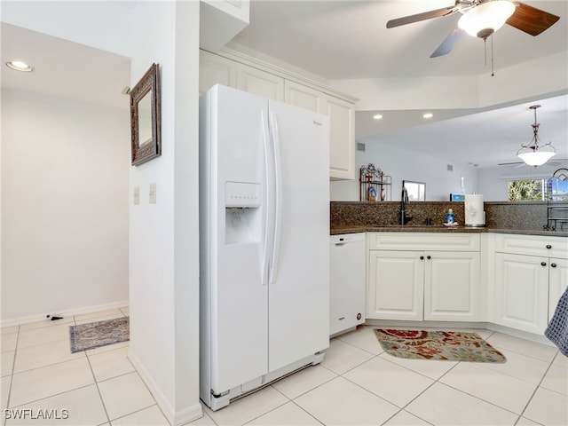 kitchen featuring sink, light tile patterned flooring, white appliances, and white cabinets