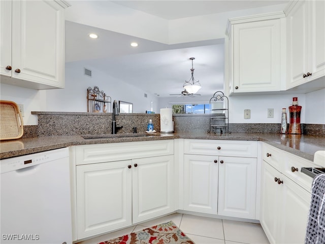 kitchen with white cabinetry, sink, kitchen peninsula, light tile patterned flooring, and white dishwasher