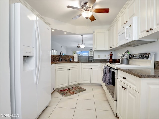 kitchen with white appliances, white cabinetry, sink, hanging light fixtures, and light tile patterned floors