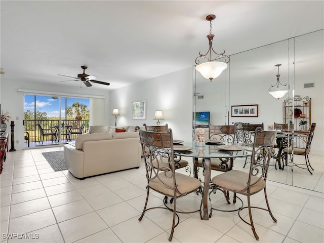 dining area featuring ceiling fan and light tile patterned floors