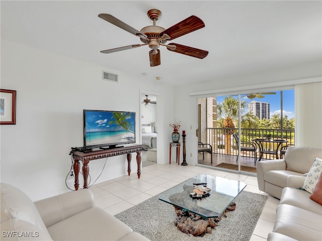 living room featuring ceiling fan and light tile patterned flooring