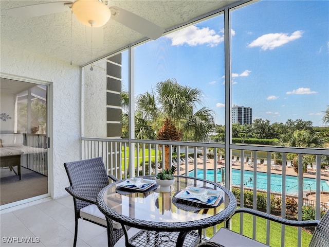 balcony featuring ceiling fan