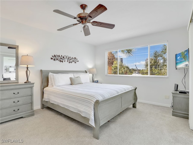 bedroom with light carpet and ceiling fan