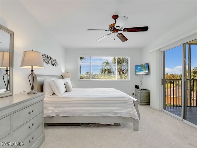 carpeted bedroom with access to exterior and ceiling fan