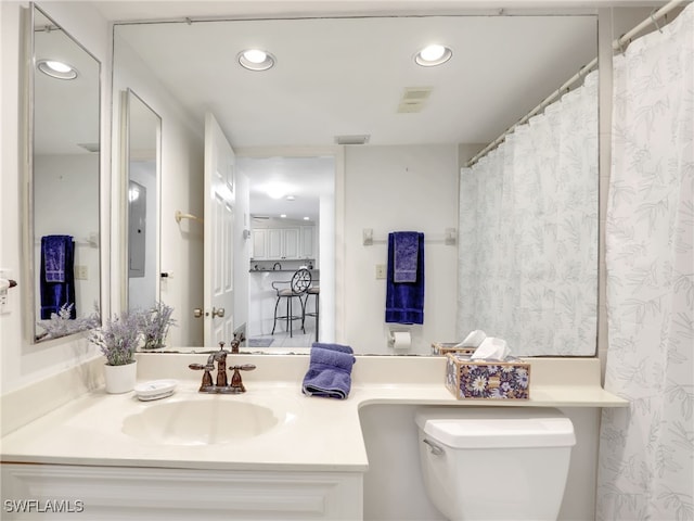 bathroom with vanity and toilet