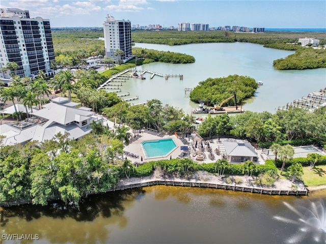 birds eye view of property with a water view