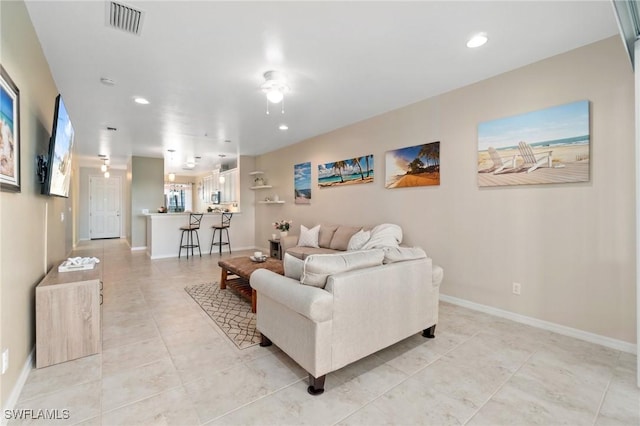 living room with light tile patterned floors