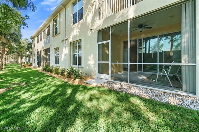 exterior space with ceiling fan