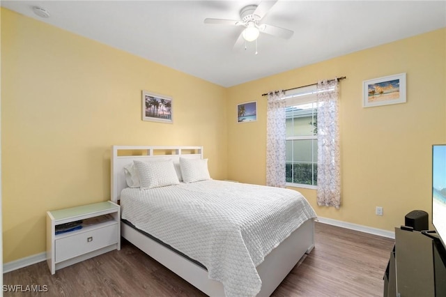 bedroom with wood-type flooring and ceiling fan