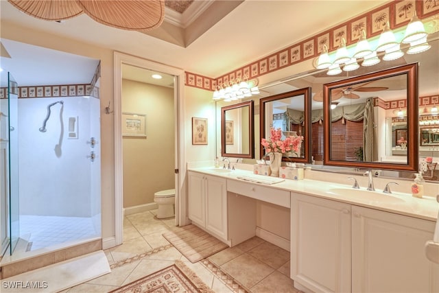 bathroom with tile patterned flooring, vanity, ornamental molding, toilet, and walk in shower