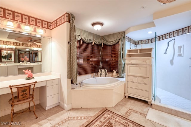 bathroom featuring tile patterned floors, independent shower and bath, and vanity