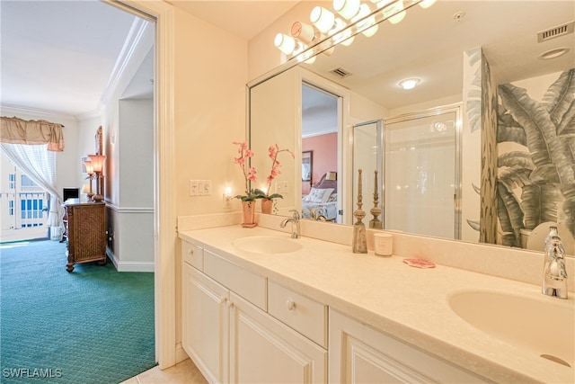 bathroom featuring crown molding, an enclosed shower, and vanity