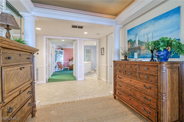 corridor featuring ornate columns, crown molding, and light tile patterned flooring