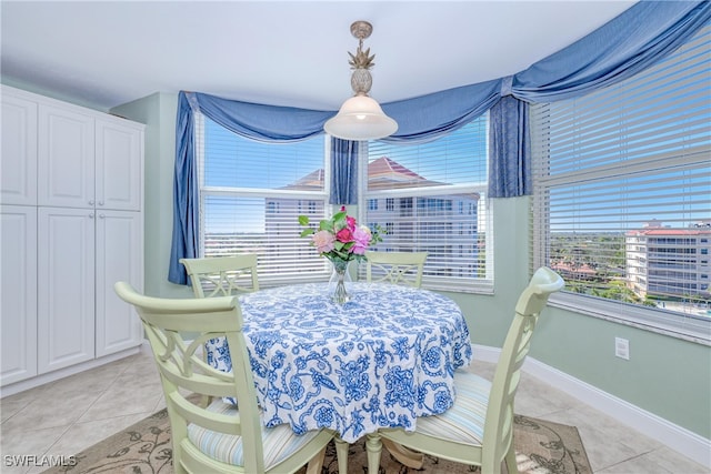 dining room featuring plenty of natural light and light tile patterned floors