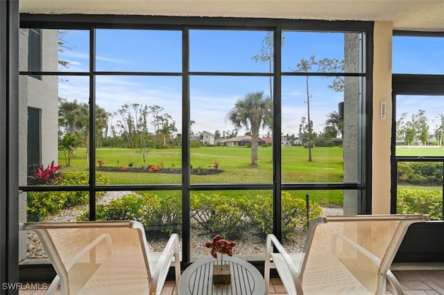 sunroom / solarium featuring plenty of natural light