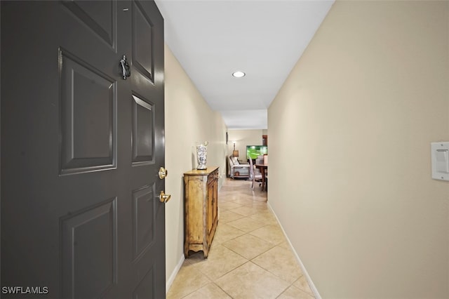 hallway with light tile patterned floors