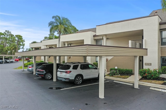 view of car parking with a carport