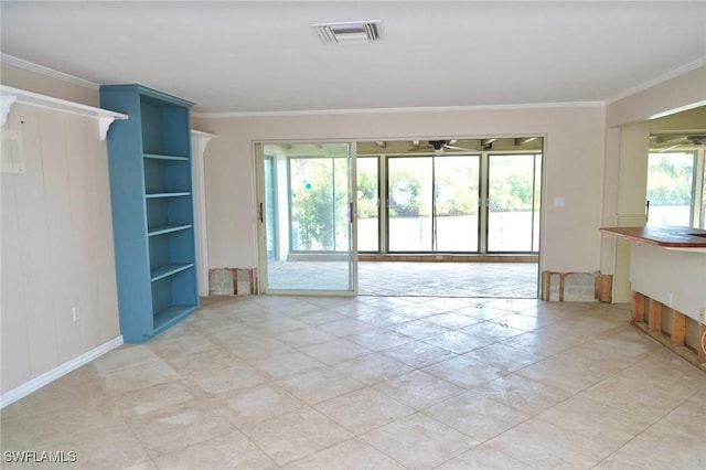 unfurnished living room with crown molding